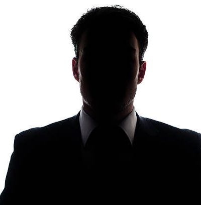 Businessman portrait silhouette and a mysterious face Businessman portrait silhouette and a mysterious face
